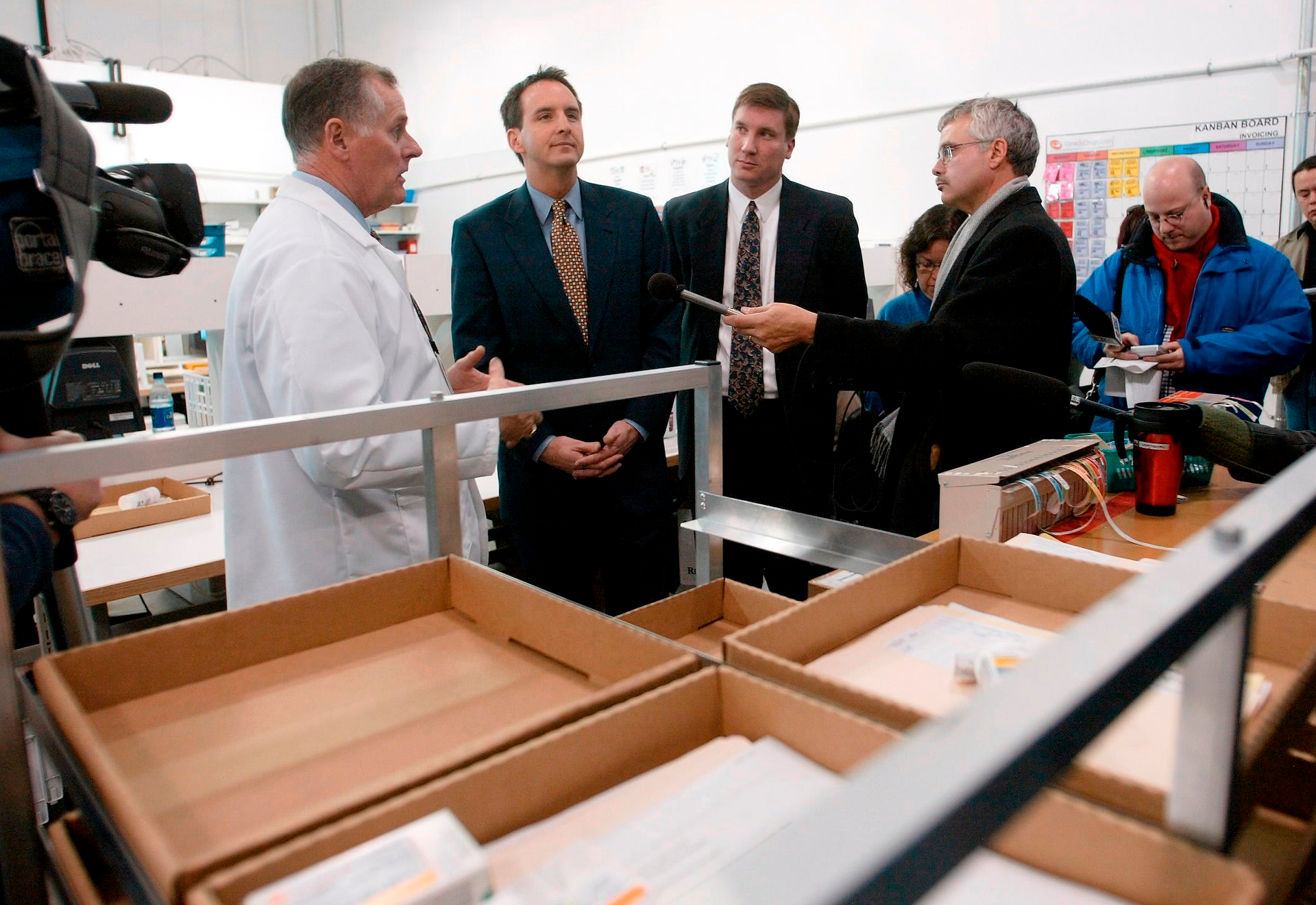 In this 2003 file photo CanadaDrugs.com Director of Pharmacy Robert Fraser, left, takes Minnesota Gov. Tim Pawlenty, second left, on a tour of the Internet pharmacy