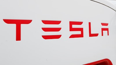 This Wednesday, March 18, 2020, file photo, shows a Tesla charging station for automobiles in Port Huron, Mich.
