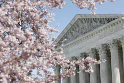 In this March 16, 2020, file photo, a tree blooms outside the Supreme Court in Washington.