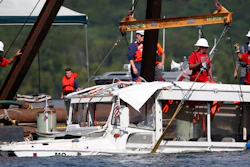 In this July 23, 2018, file photo, a duck boat that sank in Table Rock Lake in Branson, Mo., is raised after it went down the evening of July 19.