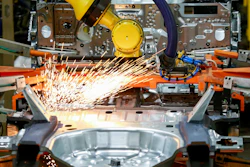 In this June 24, 2019, file photo machines work on a Ford vehicle assembly line at Ford's Chicago Assembly Plant in Chicago.