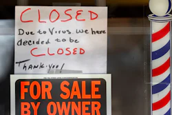 In this April 2, 2020 file photo, 'For Sale By Owner' and 'Closed Due to Virus' signs are displayed in the window of a store in Grosse Pointe Woods, Mich. The second round of loan applications for the government's small business relief program has been slowed by computer issues at the Small Business Administration. Lenders complained Monday, April 27, that they couldn't get their applications into the SBA system known as ETran that processes and approves loans.