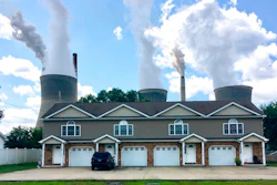 In this Aug. 23, 2018, file photo, a coal-fired plant in Winfield, W.Va, is seen from an apartment complex in the town of Poca across the Kanawha River. The Trump administration is gutting an Obama-era rule that compelled coal plants to cut back emissions of mercury and other human health hazards, limiting future regulation of air pollutants by petroleum and coal plants.