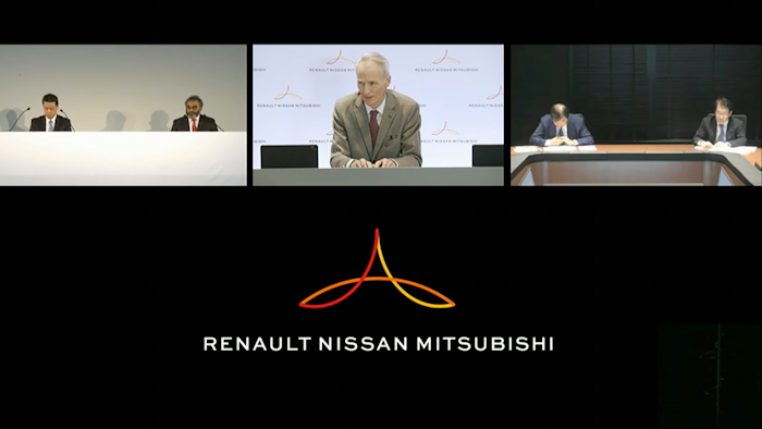 Alliance Operating Board Chairman Jean-Dominique Senard, center, Nissan Chief Executive Makoto Uchida, left, and Mitsubishi Motors Chairman, Osamu Masuko, second right, listen to a reporter's question during an online news conference.
