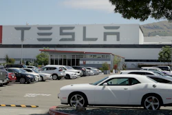 Vehicles are seen parked at the Tesla car plant.