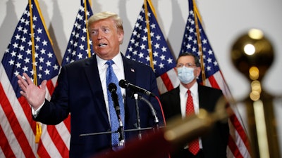 President Donald Trump speaks with reporters after meeting with Senate Republicans.