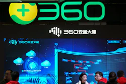 Visitors tour the Chinese internet security firm Qihoo 360.