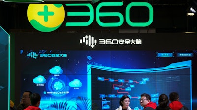 Visitors tour the Chinese internet security firm Qihoo 360.