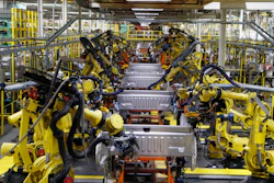 In this Sept. 27, 2018 file photo, robots weld the bed of a 2018 Ford F-150 truck on the assembly line at the Ford Rouge assembly plant in Dearborn, Mich.
