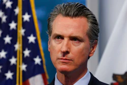 In this April 9, 2020, file photo, California Gov. Gavin Newsom listens to a reporter's question during his daily news briefing in Rancho Cordova, Calif. California's major deal for hundreds of millions of N95 respirator masks hit a delay in its federal certification process, Gov. Gavin Newsom said Wednesday, May 6, 2020, as he promised details of the contract would soon be made public.