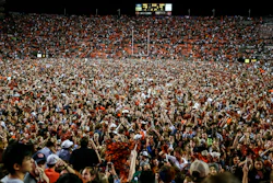Fans storm the field after Auburn defeated Alabama 48-45 in Auburn, Ala., Nov. 30, 2019.