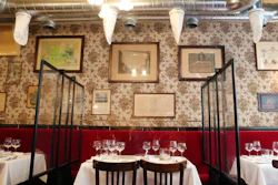 Plastic shields and filtration system placed to prevent the travel of coronavirus particles at Alain Ducasse's restaurant in Paris, June 11, 2020.