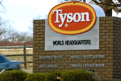 In this Jan. 29, 2006, file photo, a car passes in front of a Tyson Foods Inc., sign at Tyson headquarters in Springdale, Ark.