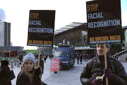 Demonstrates in front of a mobile police facial recognition facility outside a shopping centre in London.