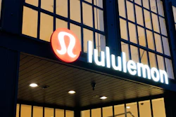This Feb. 20, 2020 file photo shows a Lululemon sign in Burlingame, Calif. Athletic apparel maker Lululemon Athletica Inc. said Monday, June 29, 2020 it's acquiring at-home exercise startup Mirror for $500 million. The deal is part of Lululemon's plan to expand beyond just selling yoga tights and other workout clothing.