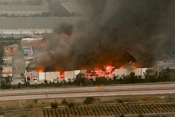 This photo taken from video provided by KABC-TV shows a raging fire destroying a huge commercial building Friday, June 5, 2020, in Redlands, Calif., about 60 miles (96 kilometers) east of Los Angeles. Firefighters from a half-dozen area agencies aided the Redlands Fire Department in shooting streams of water on flames that engulfed the structure, collapsed the roof and burned truck trailers parked at loading docks. The nearby 10 Freeway was shut down in both directions for several hours as flames shot high into the air.