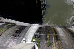 Excess water spills over the top of a dam on the lower Klamath River.