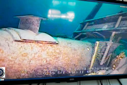 This June 2020 file photo, shot from a television screen, shows damage to anchor support EP-17-1 on the east leg of the Enbridge Line 5 pipeline within the Straits of Mackinac in Michigan.