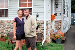 Crystal and Chris Martin stand outside their home, Sunday, July 19, 2020 in Burton, Mich.