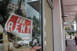 For Rent sign hangs on a closed shop.