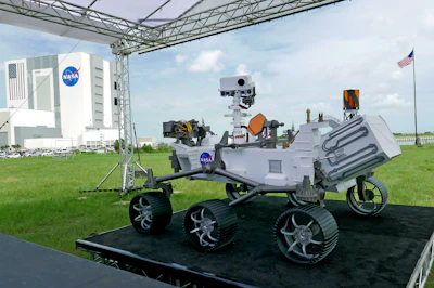 A replica of the Mars rover Perseverance is displayed outside the press site before a news conference at the Kennedy Space Center Wednesday, July 29, 2020, in Cape Canaveral, Fla. United Launch Alliance Atlas V rocket launch scheduled for tomorrow will transport the rover to Mars.