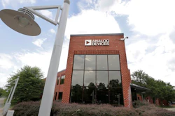 Clouds are reflected in the headquarters of Analog Devices, Inc., Monday, July 13, 2020, in Norwood, Mass. Computer chip maker Analog Devices is buying Maxim Integrated in an all-stock deal that will create a company worth about $68 billion, and strengthens its position in the analog semiconductor sector.