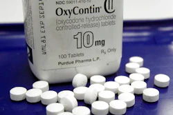 A Feb. 19, 2013, file photo shows OxyContin pills arranged for a photo at a pharmacy in Montpelier, Vt. A federal bankruptcy judge ruled Tuesday, July 28, 2020 that OxyContin maker Purdue Pharma can't make any more contributions to partisan organizations that seek to boost the election efforts of candidates for state attorney general offices.