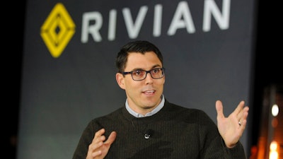 Rivian Founder and CEO RJ Scaringe unveils the first-ever electric adventure vehicle before it's official reveal at the LA Auto Show at the Griffith Observatory on Monday, Nov. 26, 2018 in Los Angeles. Electric vehicle startup Rivian says it has raised another $2.5 billion in funding from accounts advised by investment firm T. Rowe Price.