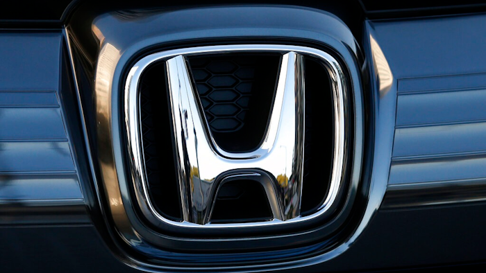 In this Jan. 11, 2016, file photo, the logo of Honda Motor Co. is seen on a Honda vehicle at the Japanese automaker's headquarters in Tokyo. Honda, on Tuesday, Aug. 4, 2020, is recalling over 1.6 million minivans and SUVs in the U.S. to fix problems that include faulty backup camera displays, malfunctioning dashboard lights and sliding doors that don’t latch properly. They cover certain Odyssey minivans from 2018 to 2020, Pilot SUVs from 2019 through 2021 and Passport SUVs from 2019 and 2020.
