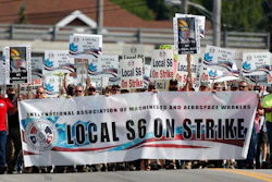 Striking Bath Iron Works shipbuilders march in solidarity.