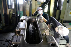 Nissan employees work on car parts made from carbon fiber reinforced plastics at the Nissan Technical Center in Atsugi, Japan, July 6, 2020.