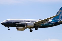 A Boeing 737 Max jet heads to a landing at Boeing Field following a test flight in Seattle.