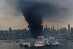 Black smoke rises from a fire at warehouses at the seaport of Beirut, Lebanon.