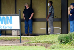In this Aug. 31, 2020, file photo, clients line up outside the Mississippi Department of Employment Security WIN Job Center in Pearl, Miss. The government issues the jobs report Friday, Sept. 4, for August at a time of continuing layoffs and high unemployment.