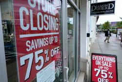 Storefront with store closing and sale signs in Dedham, Mass., Sept. 2, 2020.