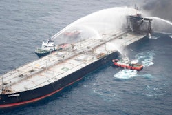 This photo released by Sri Lankan Air Force shows ships fighting fire on the MT New Diamond, about 30 nautical miles off the coast of Sri Lanka, Tuesday, Sept. 8, 2020. Ships and aircraft from Sri Lanka and India intensified efforts to extinguish a new fire on an oil tanker off Sri Lanka's coast on Tuesday, two days after the previous three-day blaze was doused, the navy said.
