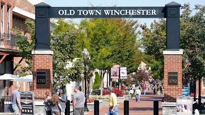 Pedestrians walk along the downtown mall area in the Old Town.