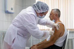 A Russian medical worker administers a shot of Russia's experimental Sputnik V coronavirus vaccine in Moscow, Russia.