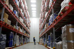 A worker moves boxes at Snowman Logistics, India's largest cold storage company in Taloja.