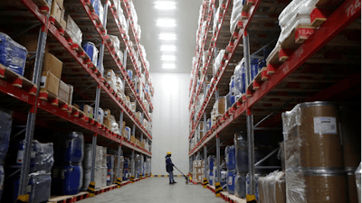 A worker moves boxes at Snowman Logistics, India's largest cold storage company in Taloja.