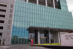 The TIPCO tower stands in Bangkok, Thailand, Wednesday, Sept. 2, 2020. One of Asia's biggest asphalt companies, Tipco Asphalt, is helping Venezuela skirt harsh U.S. sanctions by moving hundreds of millions of dollars on behalf of the state-run oil company PDVSA, according to an Associated Press investigation.