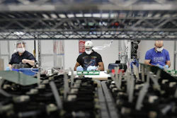 Line workers put together ventilators at the Ford Rawsonville plant in Ypsilanti Township, Mich., May 13, 2020.
