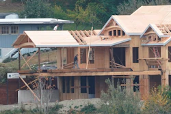 Workers at a home under construction along the waterfront in Gig Harbor, Wash., Oct. 28, 2020.