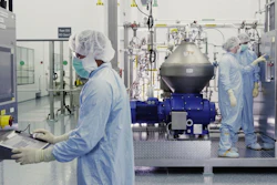 Scientists work with a bioreactor at a Regeneron Pharmaceuticals facility in New York state.