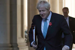 Britain's Prime Minister Boris Johnson walks back towards 10 Downing Street following a cabinet meeting in London, Nov. 3, 2020.