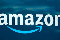 An Amazon logo appears on an Amazon delivery van.