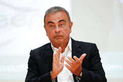Nissan's former executive Carlos Ghosn attends a press conference.