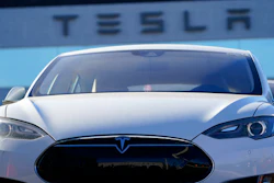 An unsold 2021 S70 sedan sits at a Tesla dealership.