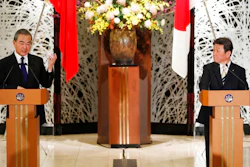 China' Foreign Minister Wang Yi, left, and his Japanese counterpart Toshimitsu Motegi participate in a press briefing in Tokyo on Tuesday, Nov. 24, 2020. Wang met Motegi on Tuesday to discuss ways to revive their pandemic-hit economies as well as regional concerns over China’s growing influence.