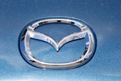 In this June 14, 2020, photograph, a Mazda company logo shines on the front of an unsold 2020 Miata at a Mazda dealership in Littleton, Colo. On Thursday, Nov. 19, Mazda beat traditional winners Lexus and Toyota to win top honors as the most dependable auto brand in Consumer Reports’ annual reliability survey. Reports surveyed organization members who own more than 300,000 vehicles from model years 2000 to 2020.